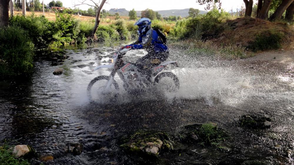Riding the motocross bike through the rivers